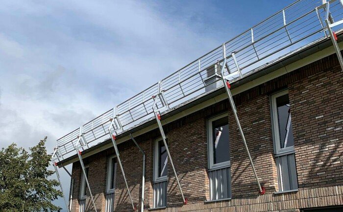 Image showing a mobile ABS Mobile Guard - pitched guard rail system installed on a pitched roof surface